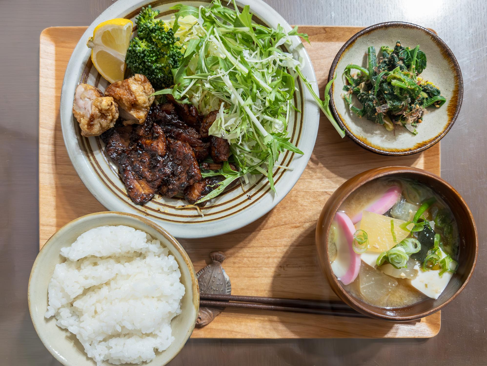 Traditional Japanese ichiju-sansai meal with rice, soup, and side dishes