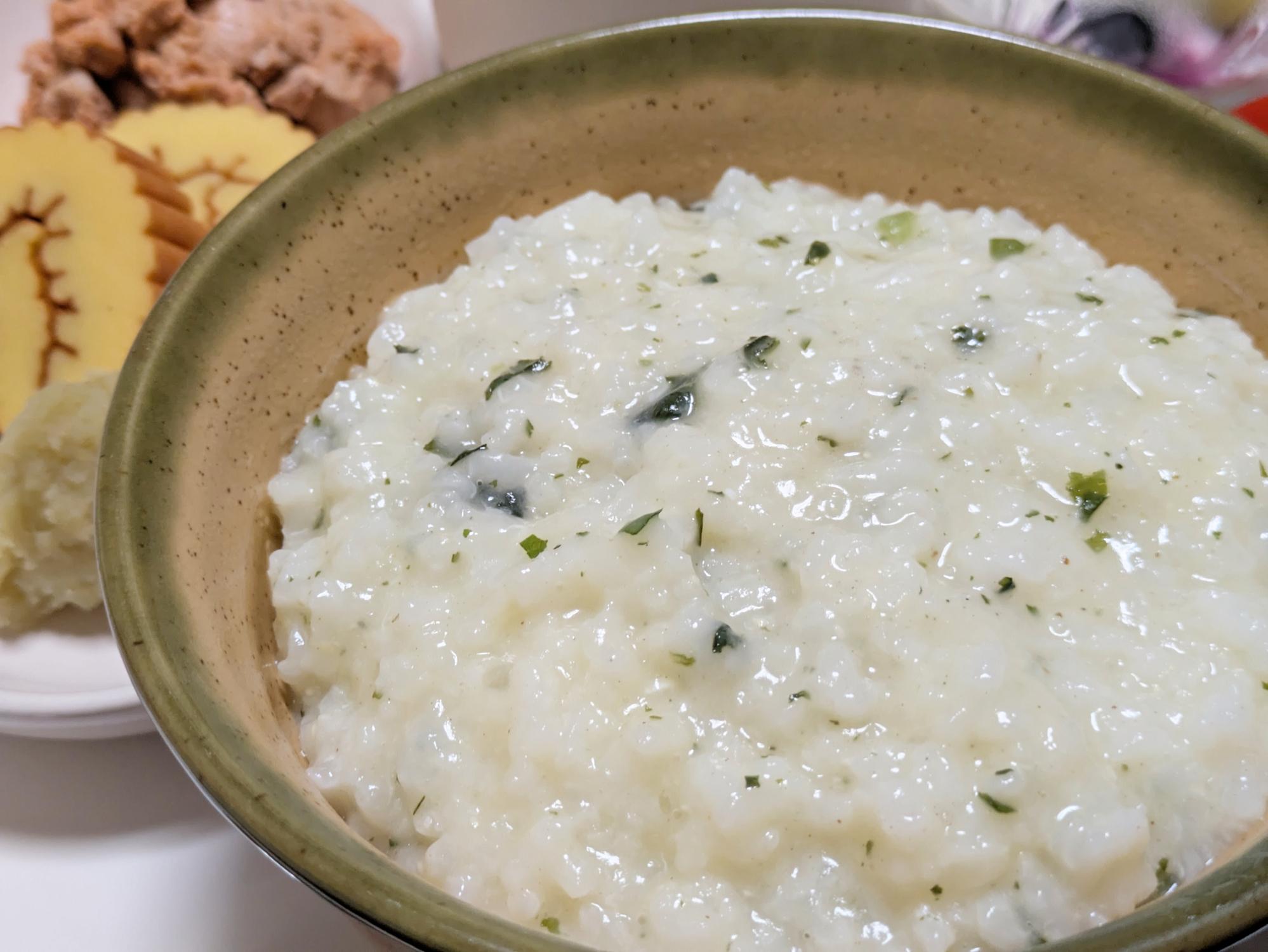Preparing Japanese okayu rice porridge at home with rice and water